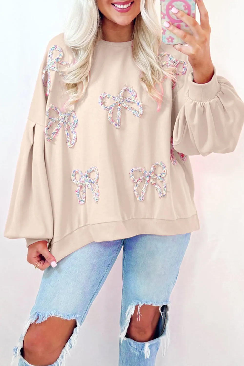 CREAM PULLOVER SWEATSHIRT W/ MULTI COLOR KNIT BOWS